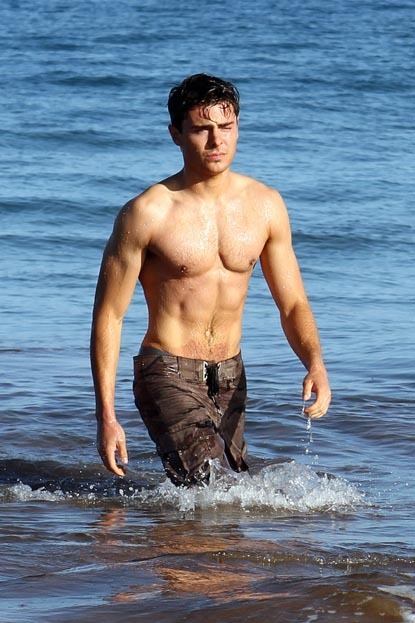 Zac Efron showing muscles